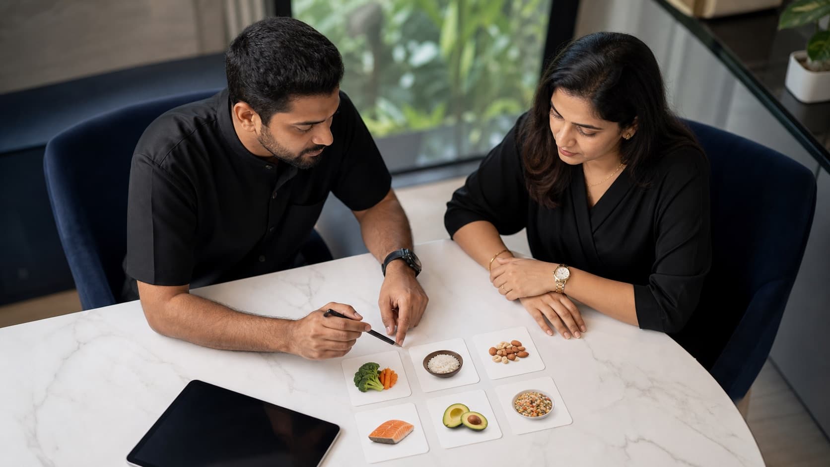A Lyxaa nutrition professional in black building a practical nutrition framework with an Indian client